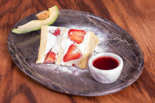istock Strawberry cake in marble plate on wooden table 1083393042