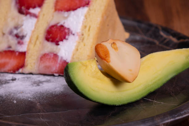 Strawberry cake and alligator pear in marble plate on wooden table Cake, Strawberry, Sponge Cake, Whipped Cream, Cream - Dairy Product yogurt fruit biscotti berry fruit stock pictures, royalty-free photos & images