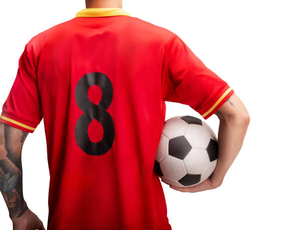 istock football player standing with a ball isolated on white 1083395026