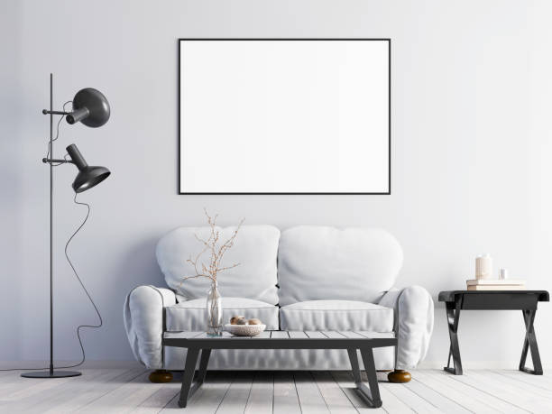 istock mock up poster on a white wall with a white sofa in a modern interior. 1083398138