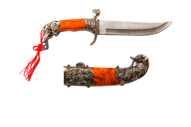 Curved ceremonial dagger knife with a decorative sheath isolated on a white background. Vintage dagger on a white background. Dagger mockup on white.