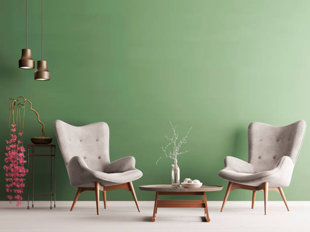 istock Empty wall in pastel modern interior with green wall, soft armchairs, plant and lamps. 1083402394