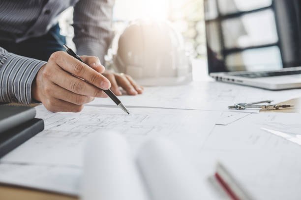 istock Architecture Engineer Teamwork Meeting, Drawing and working for architectural project and engineering tools on workplace, concept of worksite on technical drawing structure and construction 1083412390