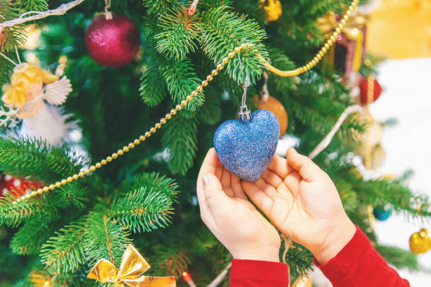 istock Child happy over christmas background. Christmas tree. Selective focus. 1083414562