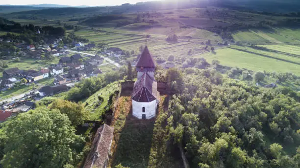 Photo of Aerial view about a beautiful old medieval small church in Nadpatak, Transylvania, Romania.