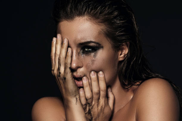 istock Beautiful woman with smudged makeup on her face 1083414878