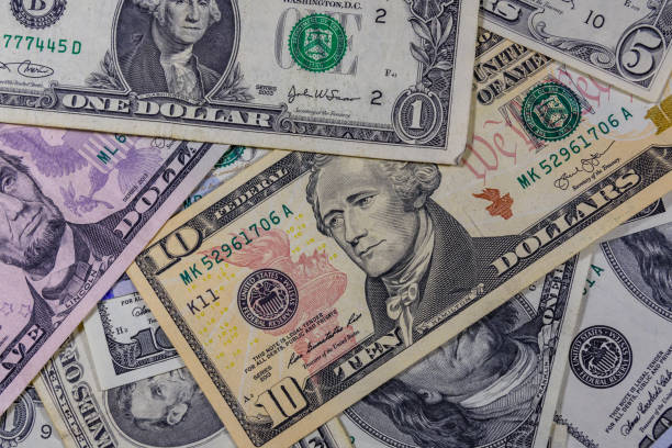 istock Background of different american dollar banknotes 1083417102