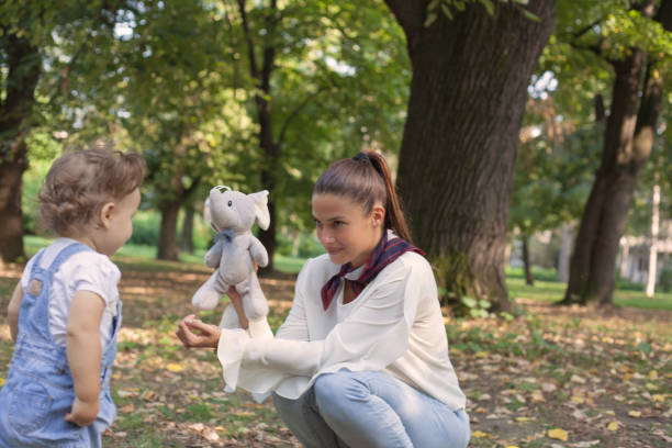 istock Mother and daughter have fun outside. Share love. 1083417588