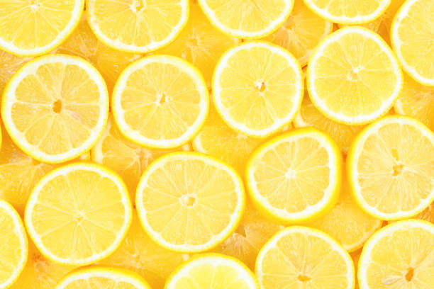 istock A slices of fresh juicy yellow lemons.  Texture background, pattern. 1083419244
