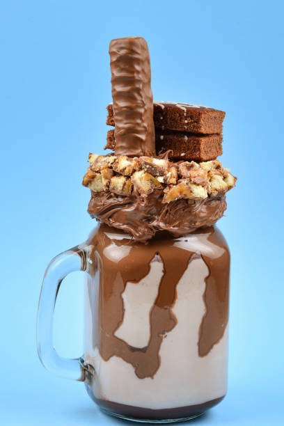 istock Chocolate extreme milkshake with brownie cake, chocolate paste and sweets. Crazy freakshake food trend. Copy space 1083420314