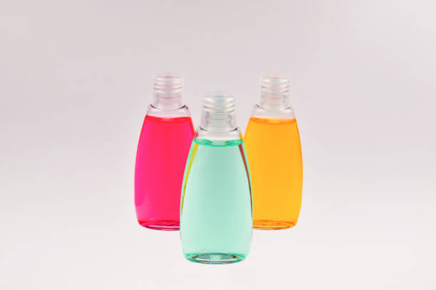 istock Four plastic bottles with liquid yellow, green and red soap. 1083420434