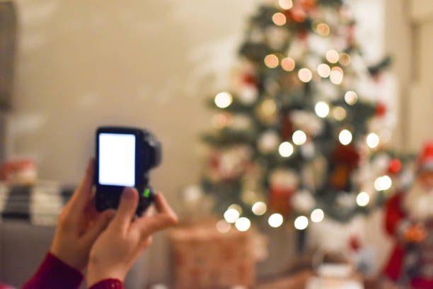 istock Young woman seat by the Christmas tree 1083426070