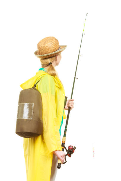 istock Woman with fishing rod, spinning equipment 1083426310