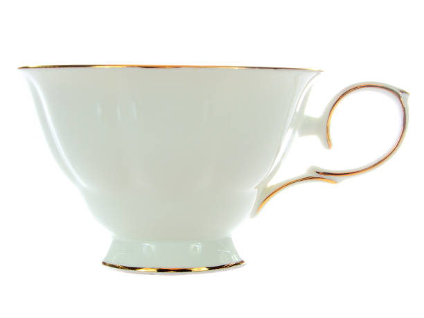 istock white porcelain cup with gold trim, side view 1083426740