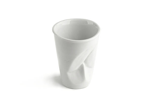 istock Design crumpled ceramic coffee cup as plastic one time cup isolated on white background. 1083429312