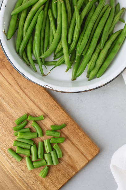 istock Fresh Green Beans on a Light Gray Background 1083431282