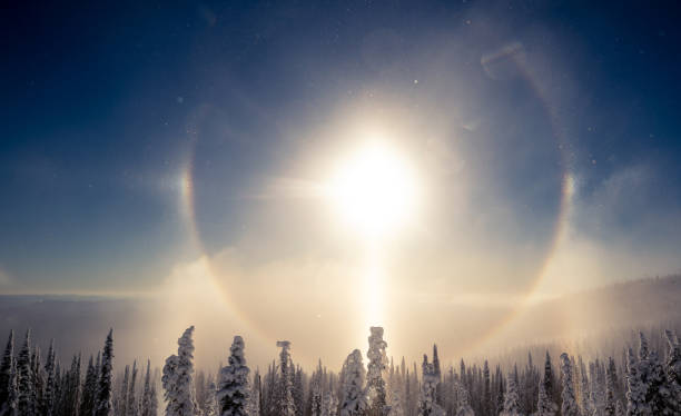 Sundog at ski hill Refraction of sunlight by ice crystals in the atmosphere. sundog stock pictures, royalty-free photos & images