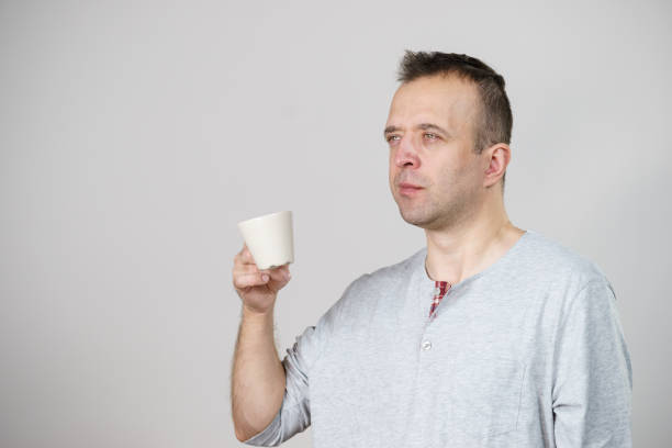 istock Tired man enjoying his coffee 1083436586
