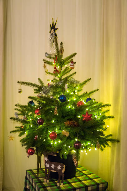 istock Christmas tree and with festive decorations at home. Natural light 1083436588