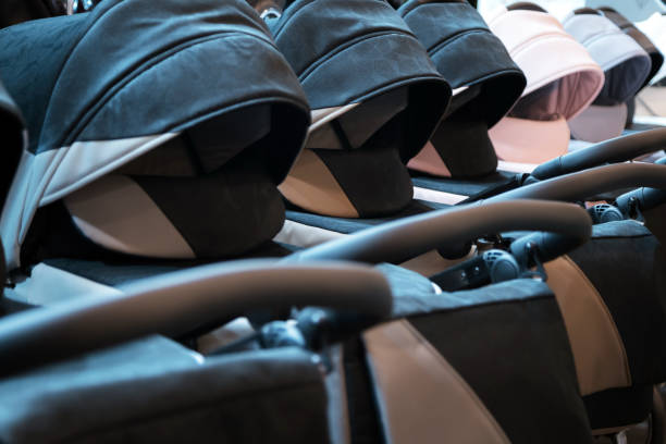 Row of baby strollers in shopping mall. Choosing baby carriage for your child Row of baby strollers in shopping mall. Choosing baby carriage for your child pushchair stock pictures, royalty-free photos & images