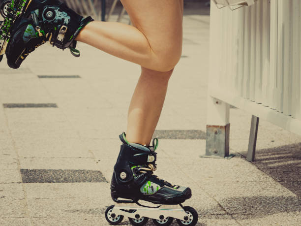 istock Woman legs wearing roller skates 1083438506