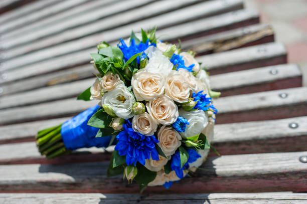 istock wedding bouquet lies on a wooden bench 1083438552
