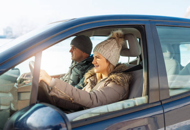 istock Female driver driving car in snow 1083441698