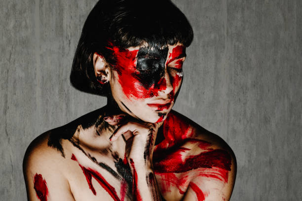 istock Colorful painting over the models face 1083441790
