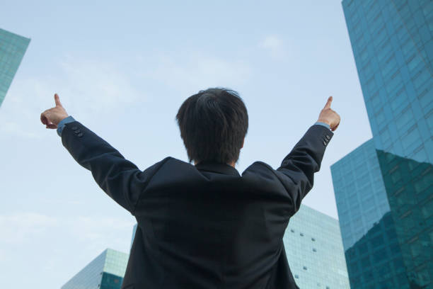 istock Chinese businessman with arms raised 1083443084