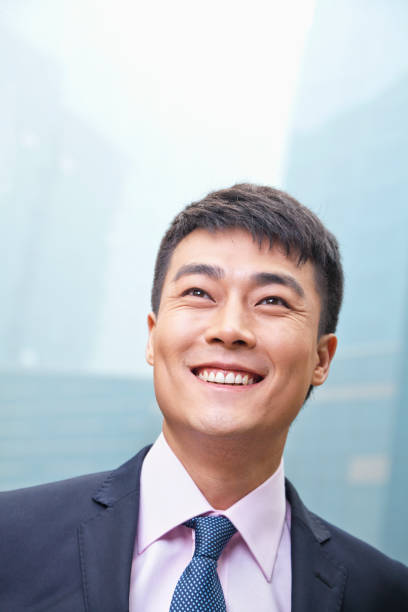 istock Chinese businessman looking away and smiling 1083443412