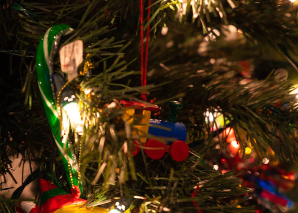 istock Christmas toy train on Christmas Tree with led lights 1083451622