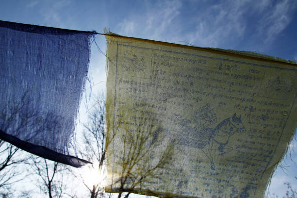 istock Buddhist tibetan prayer flags waving in the wind against blue sky 1083453894