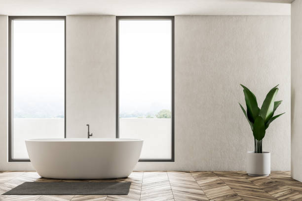 istock White loft bathroom interior with white tub 1083454690