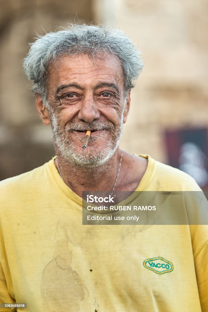 Portrait Of A Greek Mature Man Smoking With Grey Hair And Beard Looking At  Camera Happy Who Works At The Port Of Rhodes Greece Stock Photo - Download  Image Now - iStock
