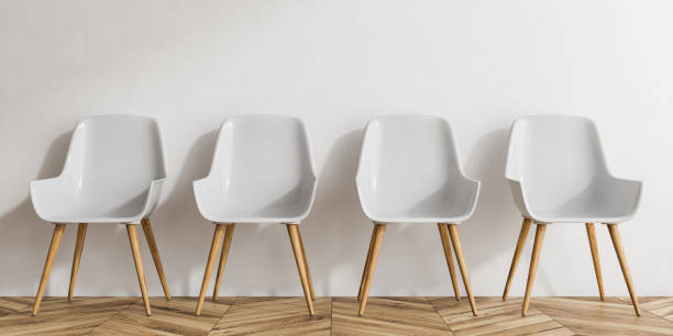 istock Row of white and wooden chairs 1083456720