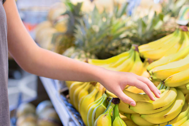 istock Female hand choosing vegetables in the store 1083459002