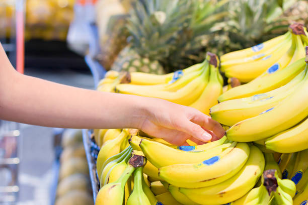 Female hand choosing vegetables in the store