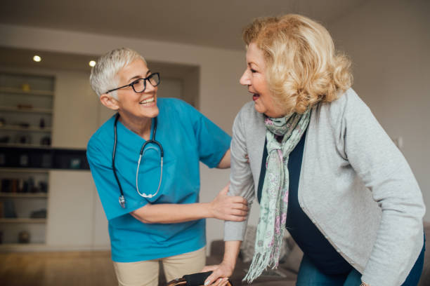 istock Happy medical worker helping patient 1083461292