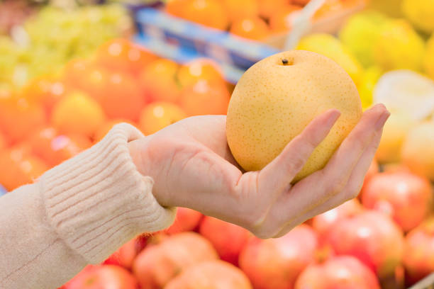 istock Female hand choosing vegetables in the store 1083461448