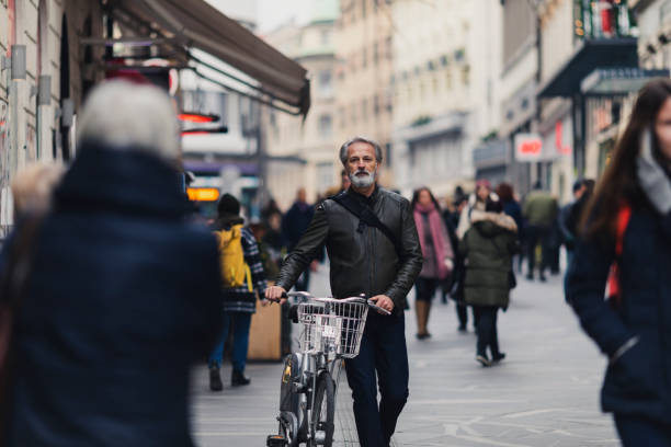 Mature man walking on the city street on a winter day