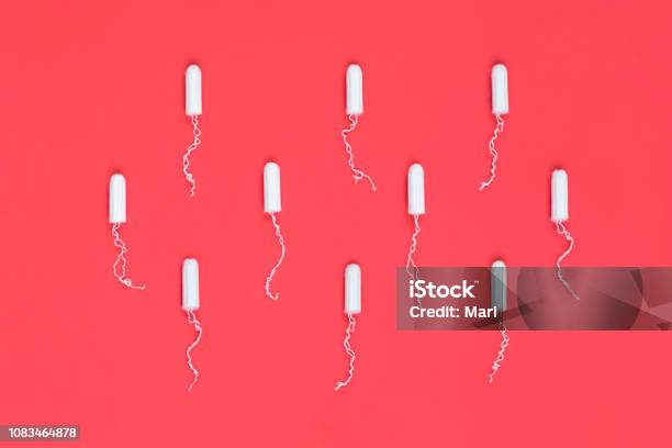 Menstrual Period Concept Woman Hygiene Protection Cotton Tampons On Red Background Top View Flat Lay Stock Photo - Download Image Now