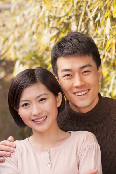 istock Chinese man hugging his girlfriend 1083464912