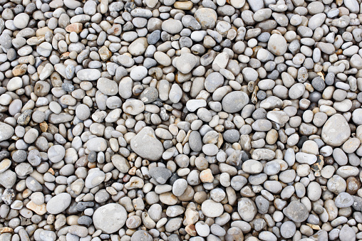 Close-up of large and small gray stones by the sea in Turkey.