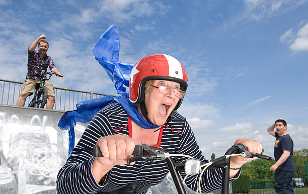 verrücktes bmx gran - stuntman stock-fotos und bilder