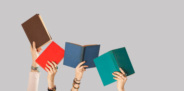 istock woman holding books 1083472720