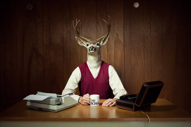 Deer CEO at His Desk A retro business man with the head of a deer / stag sits in his vintage wood paneled 1970's style office, holding a mug that says "The Boss".  Complete with box phone and typewriter.  Horizontal with copy space.

[url=http://www.istockphoto.com/file_search.php?action=file&lightboxID=13702551][IMG]http://i186.photobucket.com/albums/x196/hybridsoul2/FunnyBus_zps7ee3b80a.jpg[/IMG][/URL]

[url=http://www.istockphoto.com/file_search.php?action=file&lightboxID=7314982][IMG]http://i186.photobucket.com/albums/x196/hybridsoul2/DeerHeadBanner.jpg[/IMG][/url] animal representation photos stock pictures, royalty-free photos & images