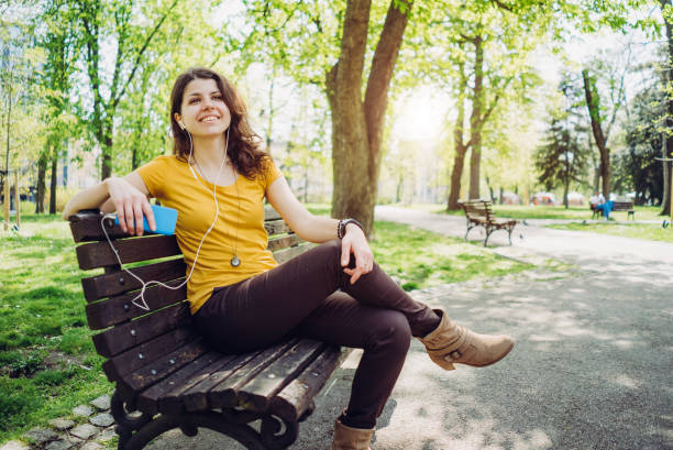 istock Listening to music in a park 1083474540