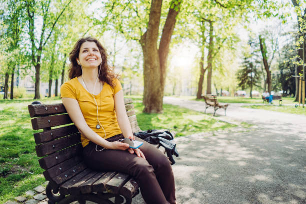 istock Listening to music in a park 1083474562