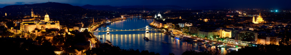 Budapest Golden Night Danube River Bridge Green Illumination with a Cruising Ferry Boat Silhouette