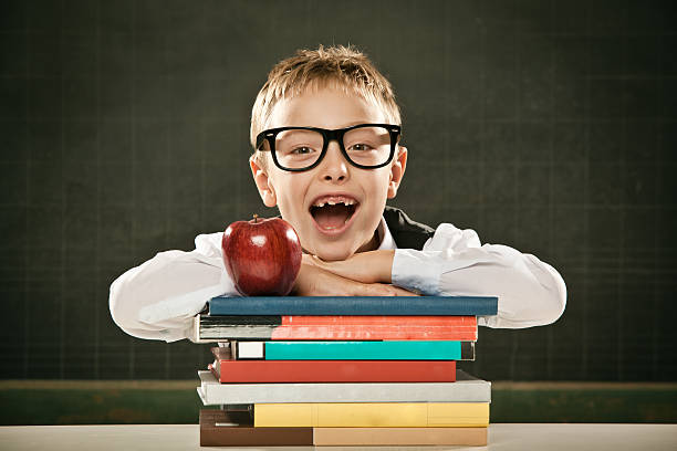 istock beautiful toothless school student kid with blackboard books and apple 108347649